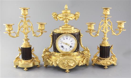 A late 19th century French bronze and ormolu clock garniture, 11.5in.